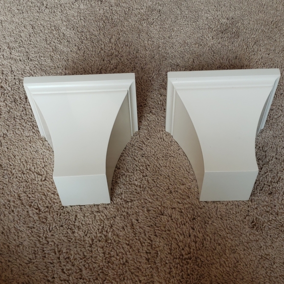 Two white small decorative shelves